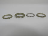 Designer Fashion Rings Lot of 4 Silver/Gold Small Clear Gems Female Adult Size 7 -- Used