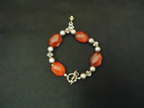 Designer Fashion Bracelet Strand/String Metal Female Adult Reds/Silvers -- Used