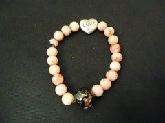 Designer Fashion Bracelet Strand/String Plastic Female Adult Pinks/Blacks -- Used