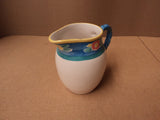 Handcrafted Drink Pitcher 8 1/4in H x 6 1/2in Diameter White/Blue/Pink Ceramic -- Used